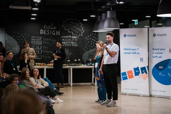 Julia and a co-host on stage at the Halo Design conference, which she co-organised.